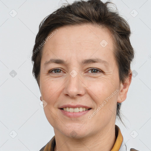 Joyful white adult female with short  brown hair and brown eyes