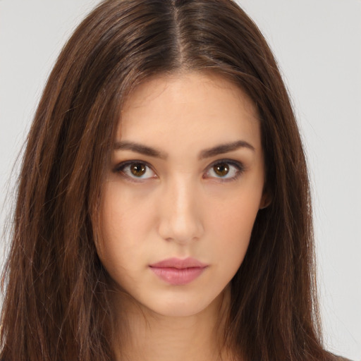 Neutral white young-adult female with long  brown hair and brown eyes