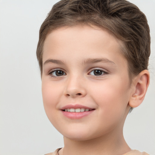 Joyful white child female with short  brown hair and brown eyes