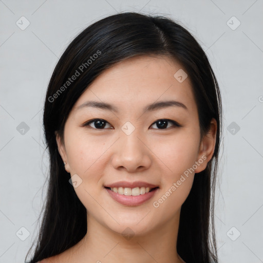 Joyful asian young-adult female with long  brown hair and brown eyes