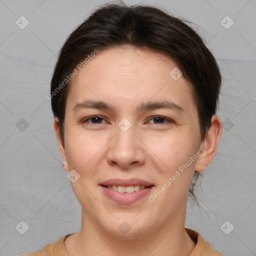 Joyful white young-adult female with short  brown hair and brown eyes