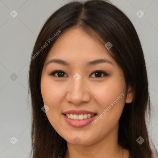 Joyful asian young-adult female with long  brown hair and brown eyes