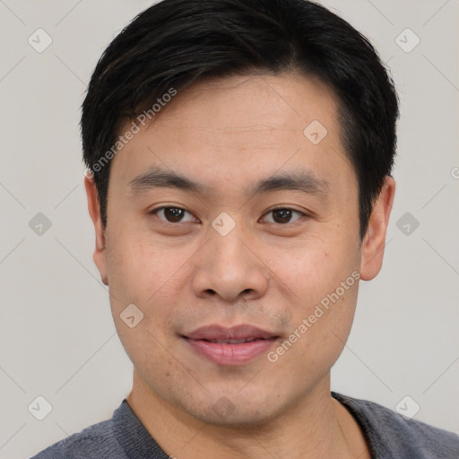 Joyful white young-adult male with short  black hair and brown eyes