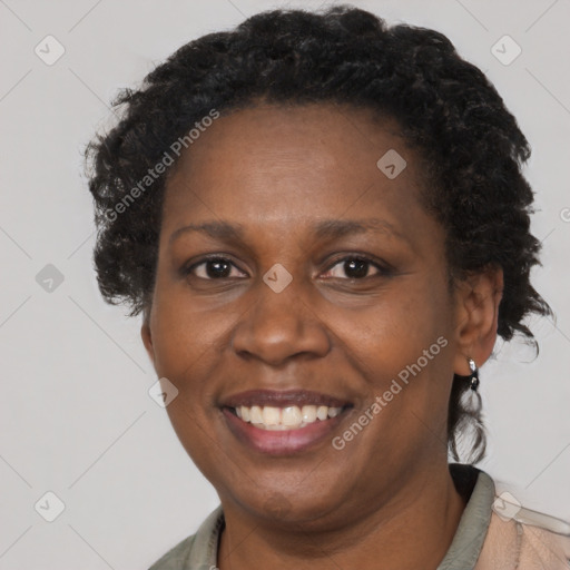 Joyful black adult female with short  brown hair and brown eyes