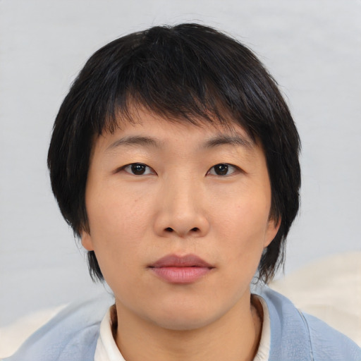 Neutral asian young-adult female with medium  brown hair and brown eyes