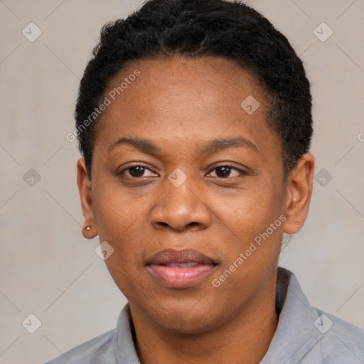 Joyful black adult female with short  black hair and brown eyes