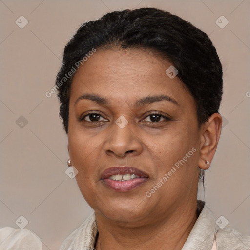 Joyful latino adult female with short  brown hair and brown eyes