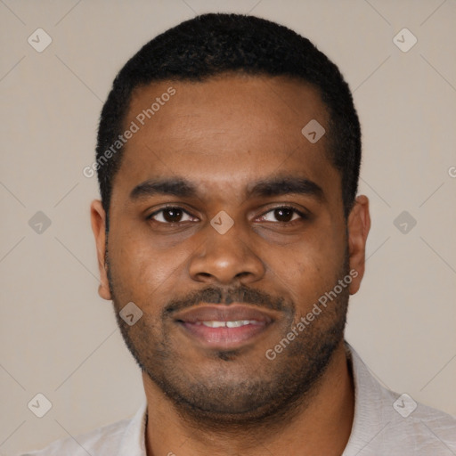 Joyful black young-adult male with short  black hair and brown eyes
