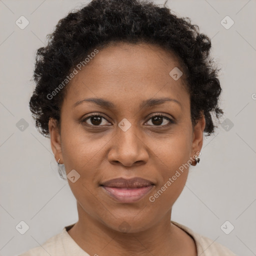 Joyful black adult female with short  brown hair and brown eyes