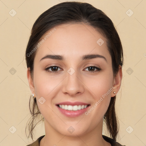 Joyful white young-adult female with long  brown hair and brown eyes