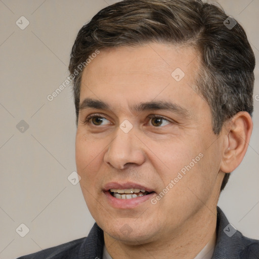 Joyful white adult male with short  brown hair and brown eyes