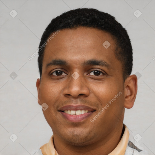 Joyful latino young-adult male with short  black hair and brown eyes
