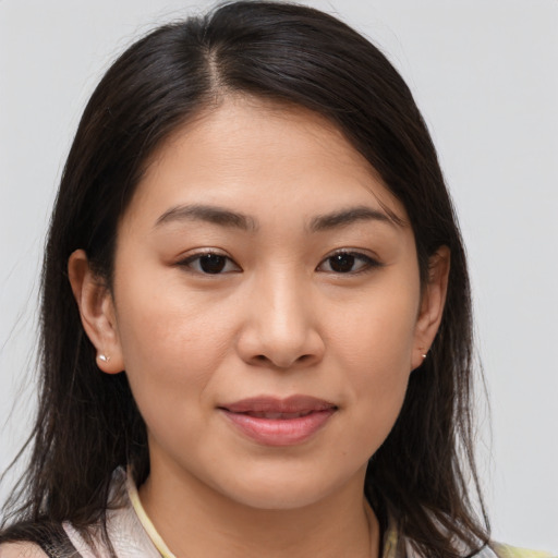 Joyful white young-adult female with medium  brown hair and brown eyes