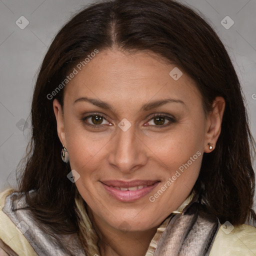 Joyful white adult female with long  brown hair and brown eyes