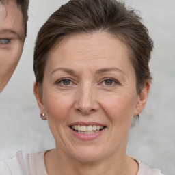 Joyful white adult female with short  brown hair and brown eyes