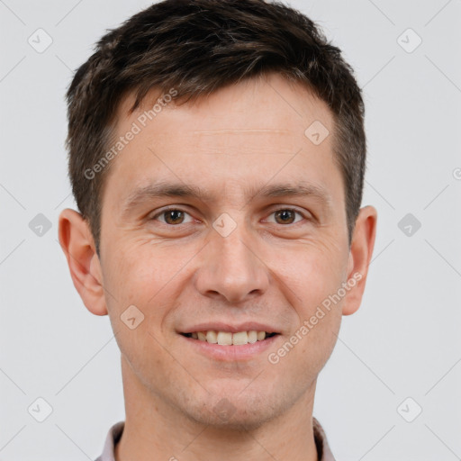 Joyful white adult male with short  brown hair and brown eyes