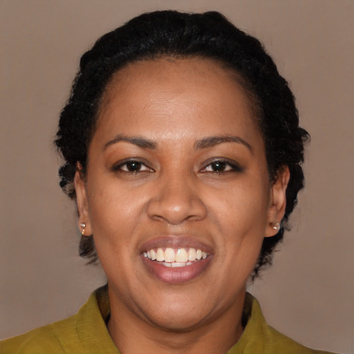 Joyful black adult female with short  brown hair and brown eyes