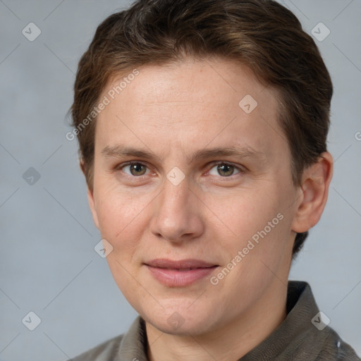 Joyful white adult female with short  brown hair and grey eyes