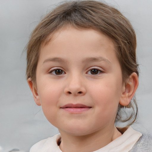 Joyful white child female with short  brown hair and brown eyes