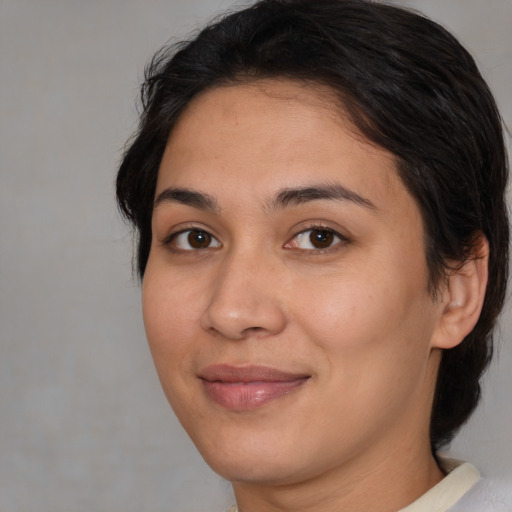 Joyful asian young-adult female with medium  brown hair and brown eyes