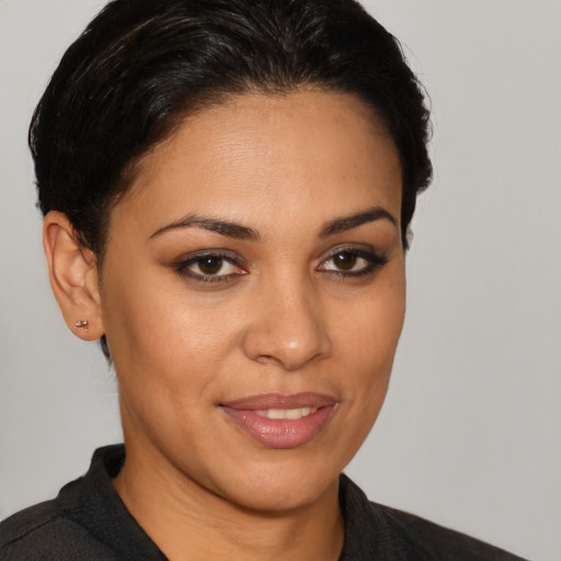Joyful latino young-adult female with short  brown hair and brown eyes