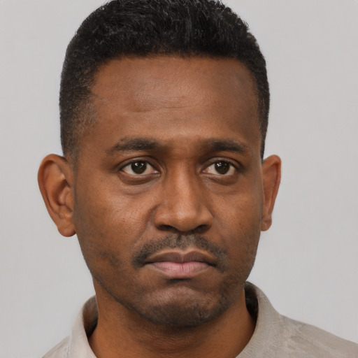 Neutral black young-adult male with short  black hair and brown eyes