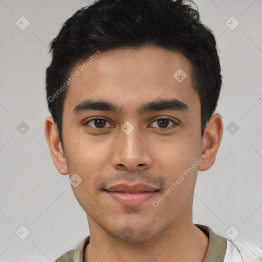 Joyful white young-adult male with short  black hair and brown eyes