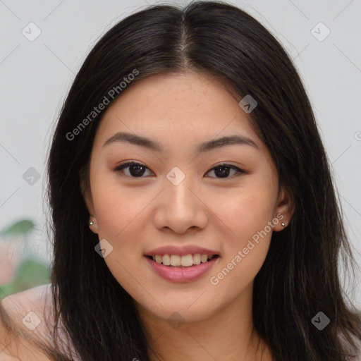 Joyful asian young-adult female with long  brown hair and brown eyes