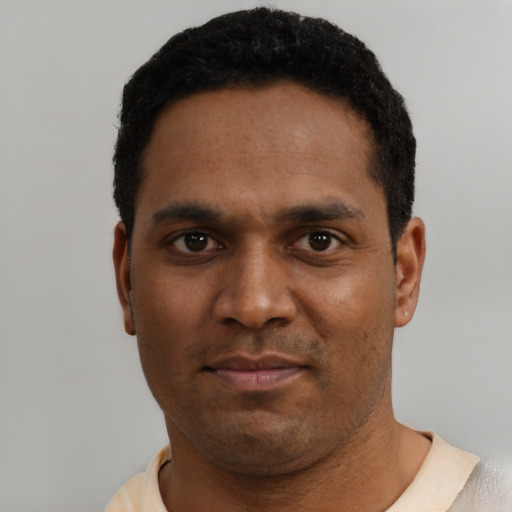Neutral black young-adult male with short  black hair and brown eyes