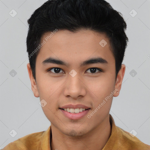 Joyful asian young-adult male with short  black hair and brown eyes