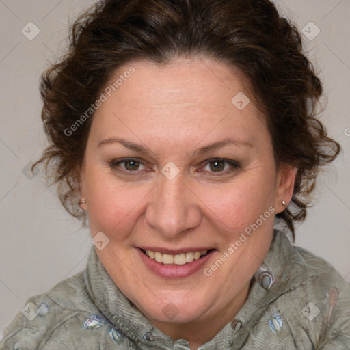 Joyful white adult female with medium  brown hair and blue eyes