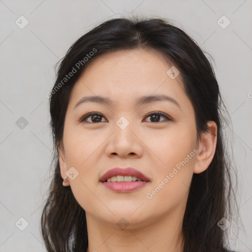 Joyful asian young-adult female with long  brown hair and brown eyes