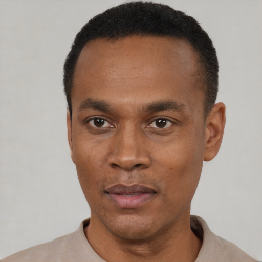 Neutral black young-adult male with short  black hair and brown eyes
