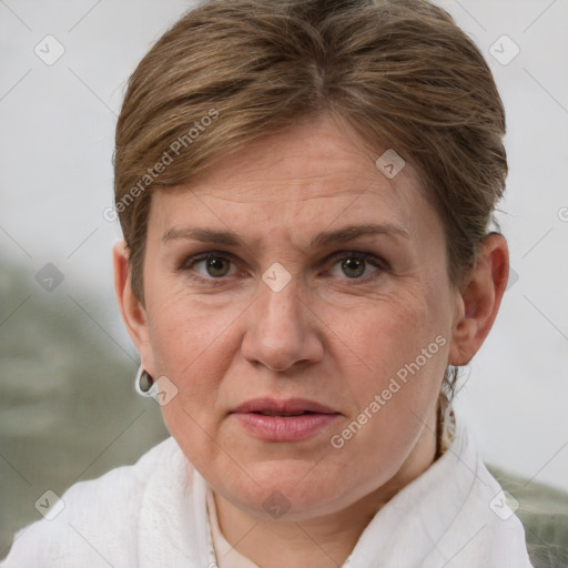 Joyful white adult female with short  brown hair and grey eyes