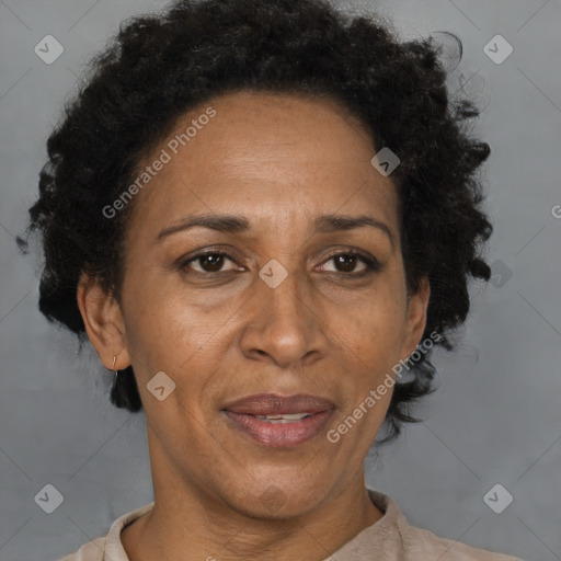 Joyful black adult female with short  brown hair and brown eyes