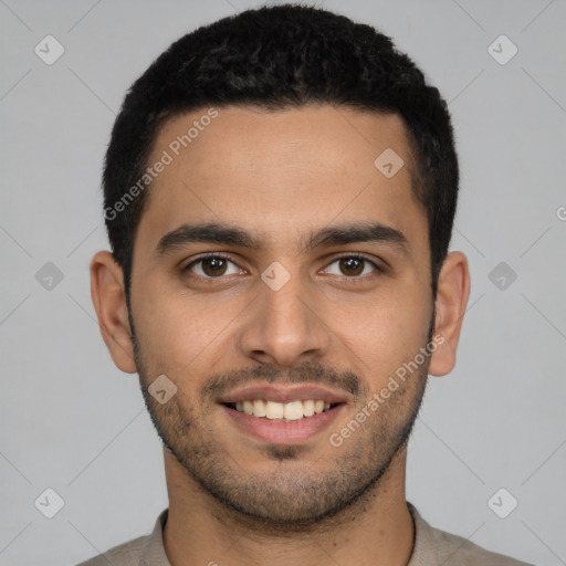 Joyful latino young-adult male with short  brown hair and brown eyes