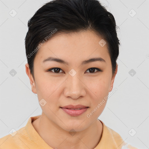 Joyful asian young-adult female with short  black hair and brown eyes