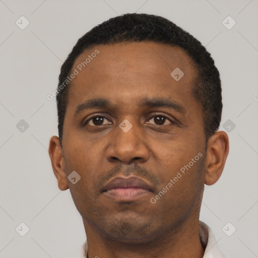 Neutral black adult male with short  black hair and brown eyes
