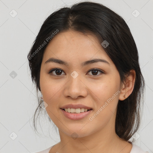 Joyful asian young-adult female with medium  brown hair and brown eyes