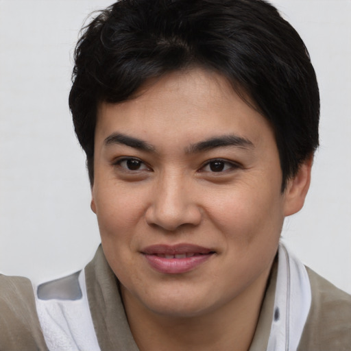 Joyful asian young-adult female with short  brown hair and brown eyes