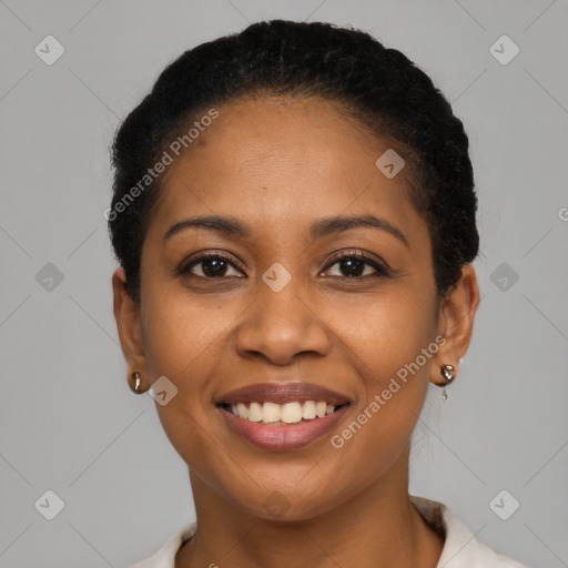 Joyful black young-adult female with short  brown hair and brown eyes