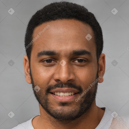 Joyful black young-adult male with short  black hair and brown eyes