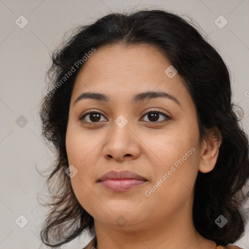 Joyful latino young-adult female with medium  brown hair and brown eyes