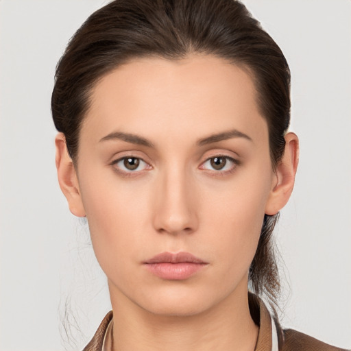 Neutral white young-adult female with medium  brown hair and brown eyes