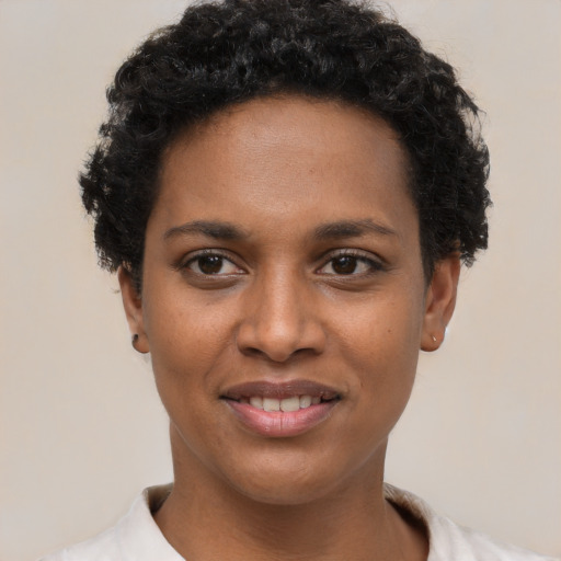 Joyful latino young-adult female with short  black hair and brown eyes