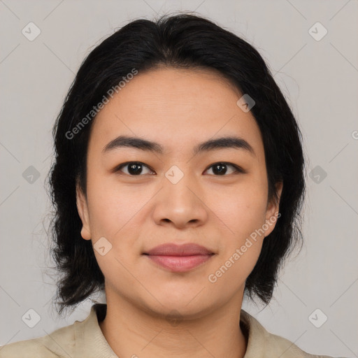 Joyful asian young-adult female with medium  black hair and brown eyes