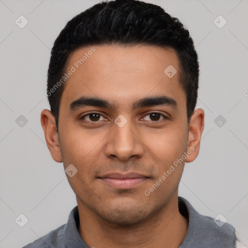 Joyful latino young-adult male with short  black hair and brown eyes