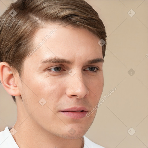 Neutral white young-adult male with short  brown hair and grey eyes