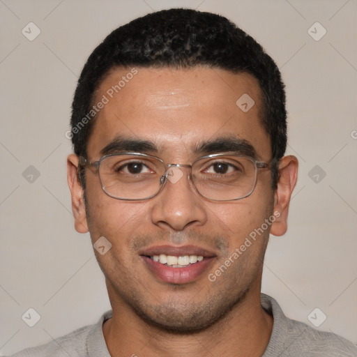 Joyful white young-adult male with short  black hair and brown eyes