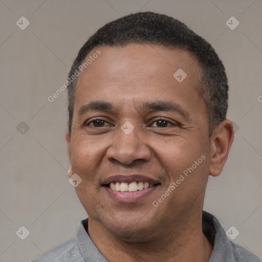 Joyful latino adult male with short  black hair and brown eyes